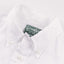 The button down collar on the White Linen shirt.