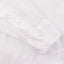 The sleeve on the White Linen shirt with two white buttons.