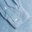 The sleeve on the Chambray Linen shirt with two white buttons.