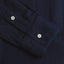 The sleeve on the Navy Overdye Seersucker shirt with two white buttons.