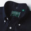 The button down collar on the Navy Overdye Seersucker Short Sleeve shirt with white buttons.