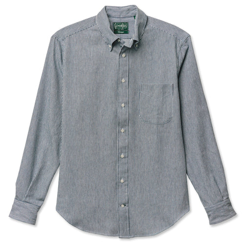A hickory striped denim button down shirt with a chest pocket and barrel cuffs, includes white buttons and is made in the USA.