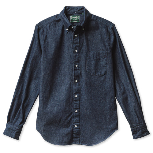 A dark denim shirt with a pocket and white buttons, includes barrel cuffs and made from 100% cotton made in the USA.