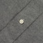 A grey flannel placket with a white button.