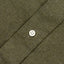 A olive flannel placket with a white button.