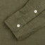 The classic olive flannel sleeve with two white buttons.