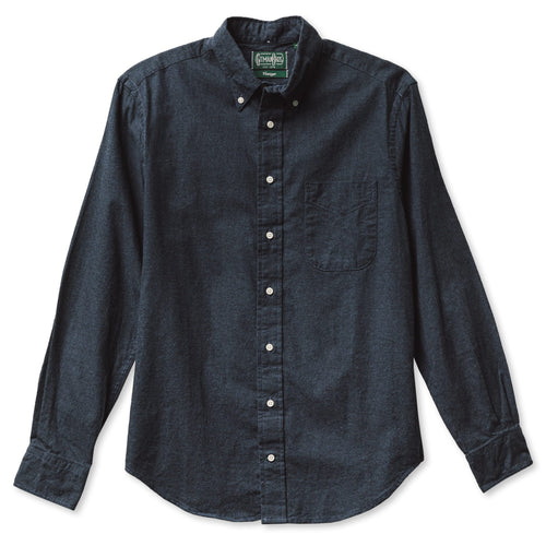 A classic navy flannel made from a soft cotton twill, with a front pocket and white buttons made in the USA.